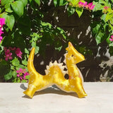 <transcy>A dragon plush toy (golden dragon) that carries the sacred energy of Bali</transcy>
