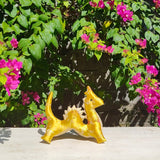 <transcy>A dragon plush toy (golden dragon) that carries the sacred energy of Bali</transcy>